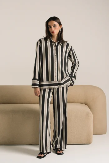Front studio portrait of Biljiki black striped two-piece set on a 5'6 model.