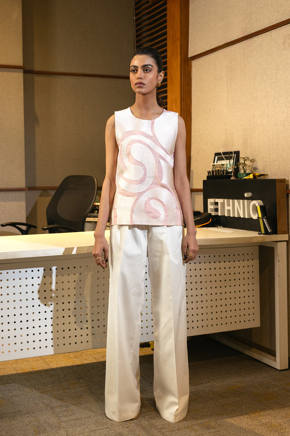 Front studio portrait of Biljiki coral embroidered cotton-linen sleeveless top on a 5'6 model.