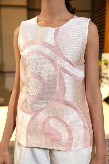 Front studio portrait of Biljiki coral embroidered cotton-linen sleeveless top on a 5'6 model.