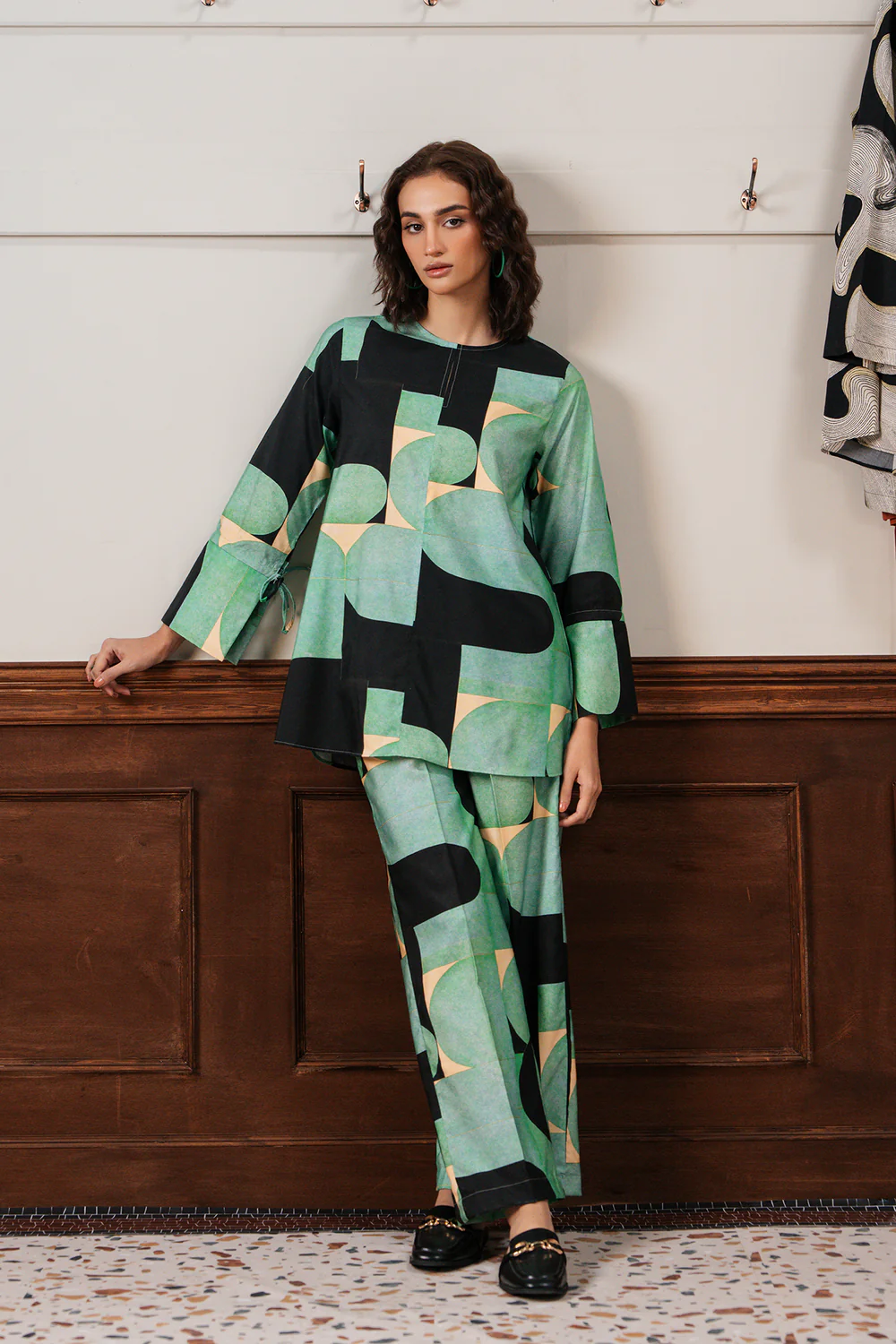 Front studio portrait of Biljiki green fluorescent abstract printed two-piece set on a 5'6 model.