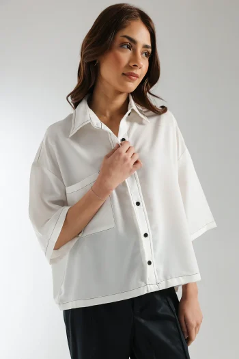 Close-up shot highlighting the sharp black contrast thread stitching and front pocket on the premium white viscose fabric.