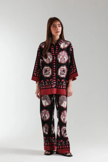 Front studio portrait of Biljiki deep black and maroon floral two-piece culotte set on a 5'6 model.