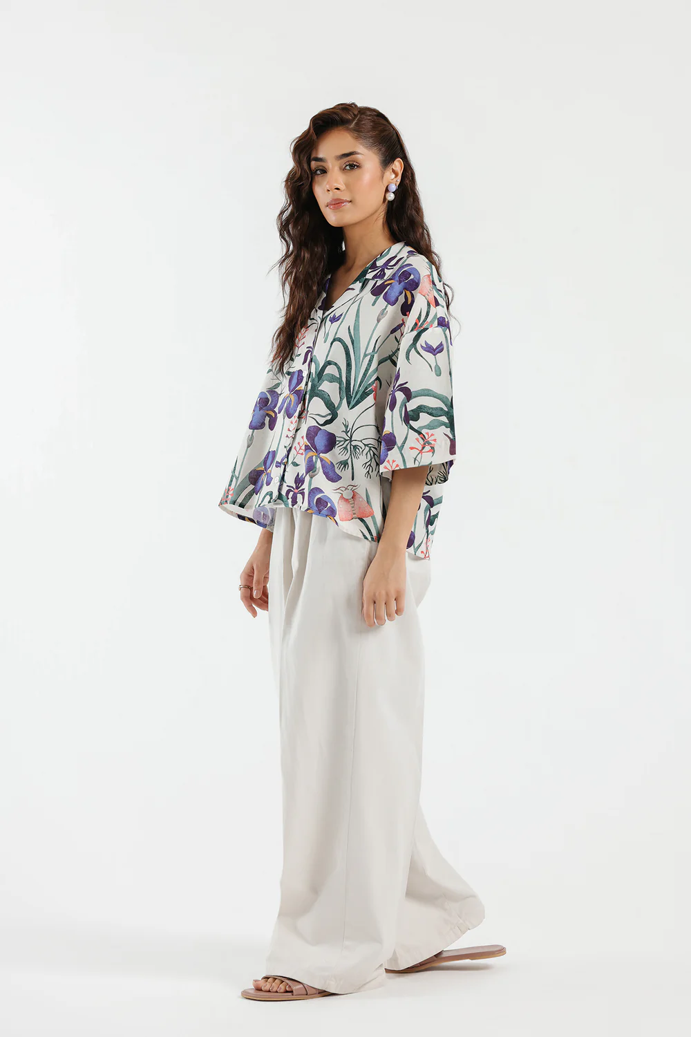 Front studio portrait of Biljiki white botanical floral cropped cotton-linen shirt on a 5'6 model.