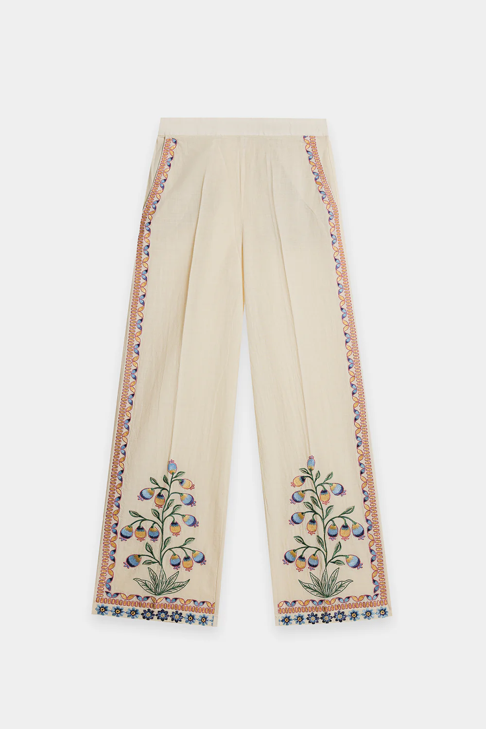 Lifestyle view showcasing the relaxed button-down silhouette and matching embroidered straight-fit trousers of the contemporary artisanal matching set.