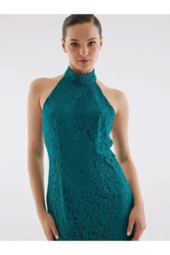 Women's green lace halter neck dress with delicate pattern and elegant fit