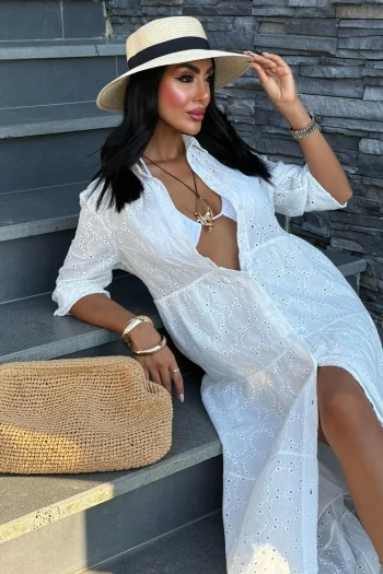 Women's white boho summer dress made of breathable cotton with flowy silhouette