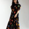 Side profile showing gathered waist and airy silhouette of the dress