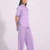 Side view showing relaxed fit and curved bottom of pastel shirt