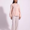 Stylish coral shirt perfect for casual events