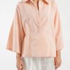 Casual summer shirt in soft orange hue for women
