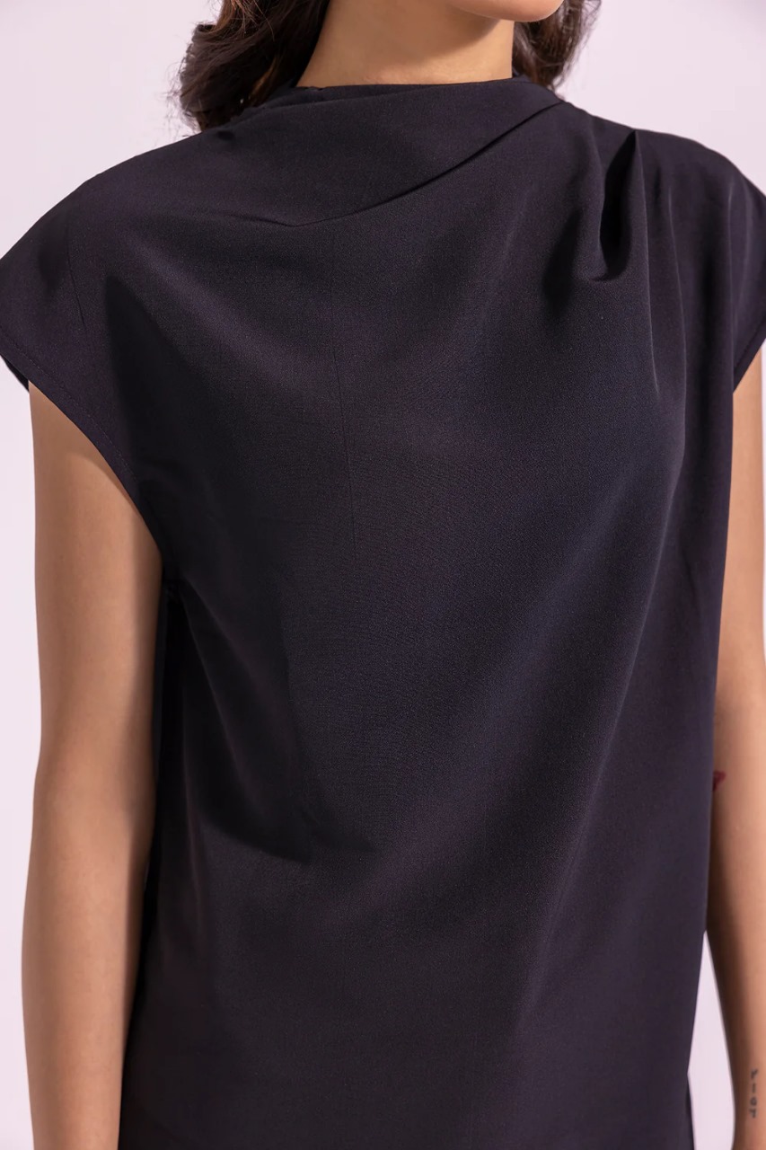 Model in sleeveless pleated top – jet black color